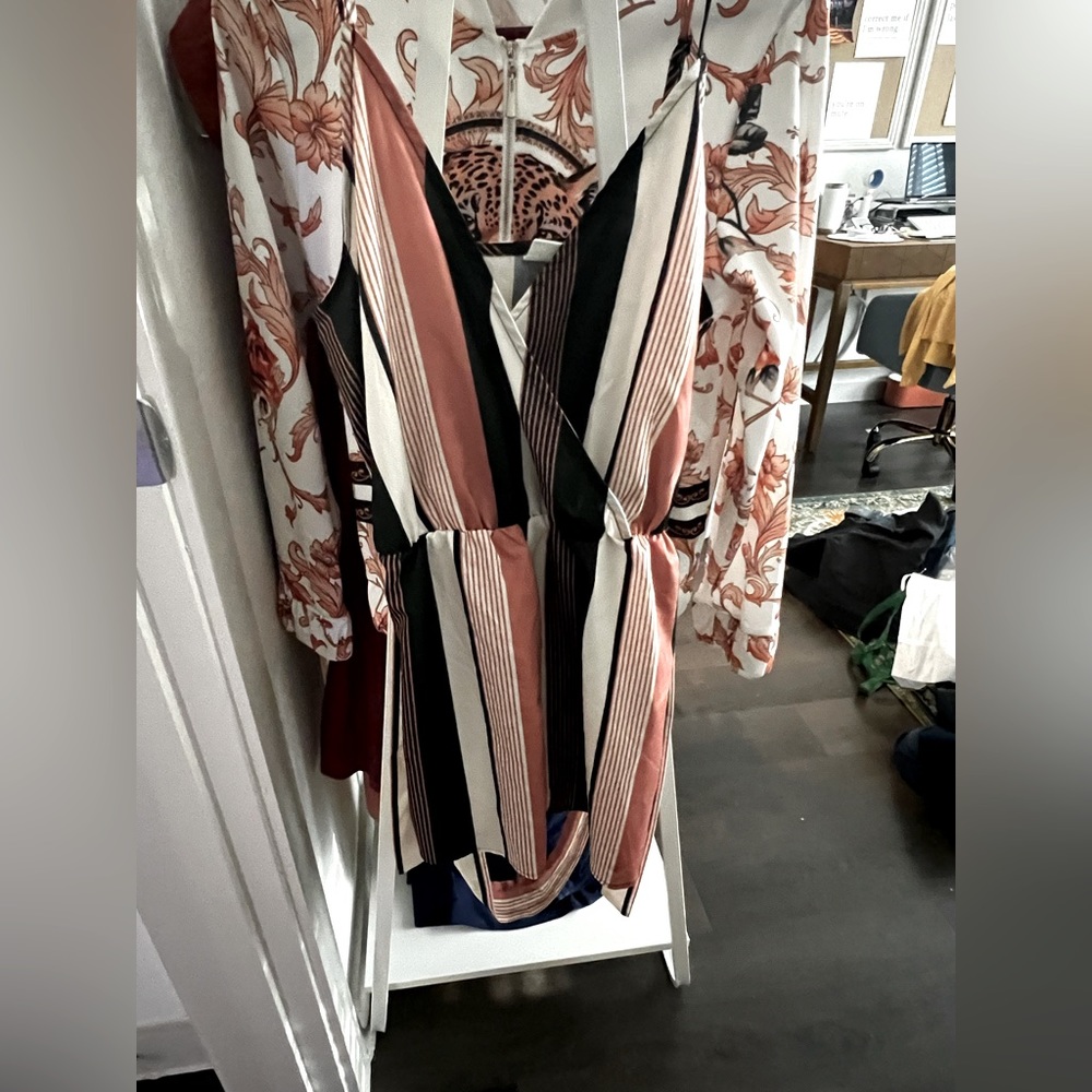 Never worn—size small. Short romper with tie